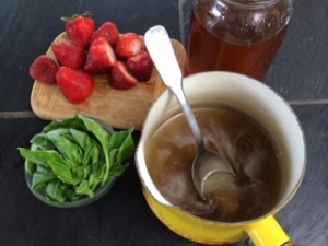 pot of steeped basil syrup after straining