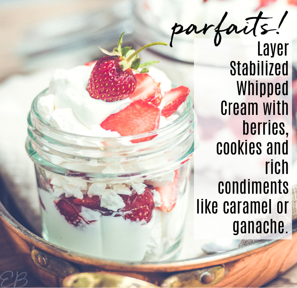 a parfait with whipped cream and berries