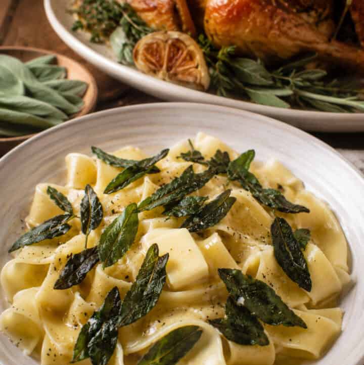 fried sage leaves garnishing pasta and chicken