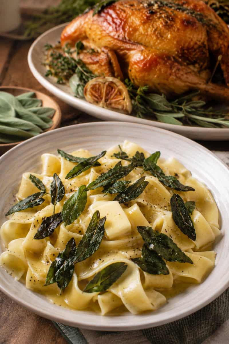 fried sage leaves garnishing pasta and chicken