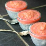 3 bowls of chia porridge with rhubarb sauce on top lined up