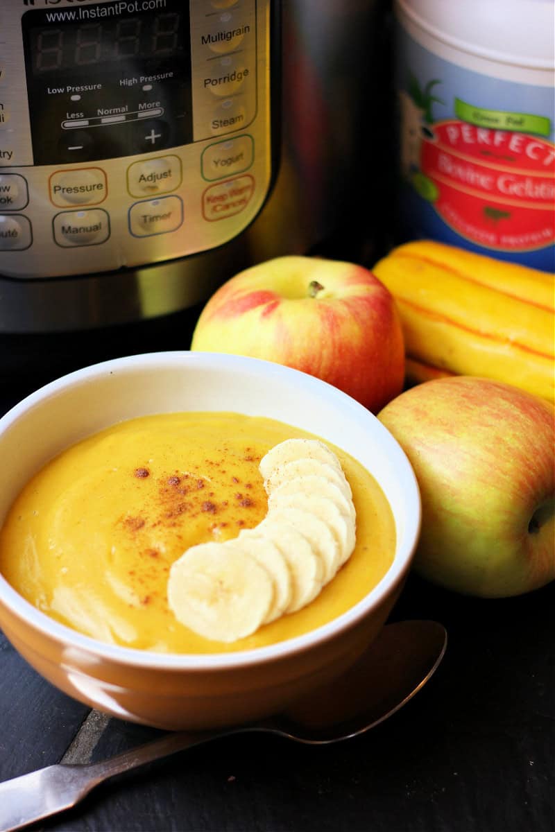 apple delicata squash porridge with fanned slices of bananas on top
