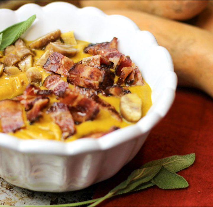 close-up view of sweet potato chestnut soup with sage and bacon that's whole30 and paleo