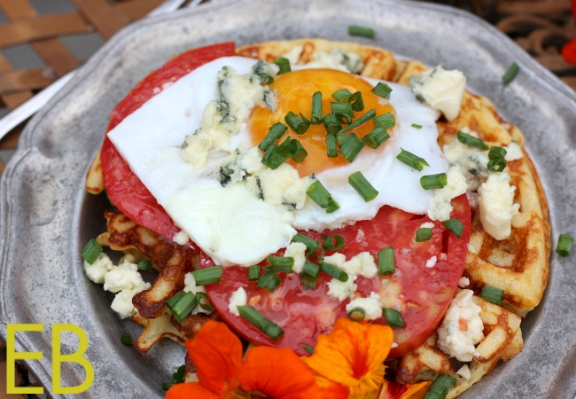 Eggs Paloma {savory Parmesan waffle, topped with sunnyside up egg, heirloom tomato and blue cheese}