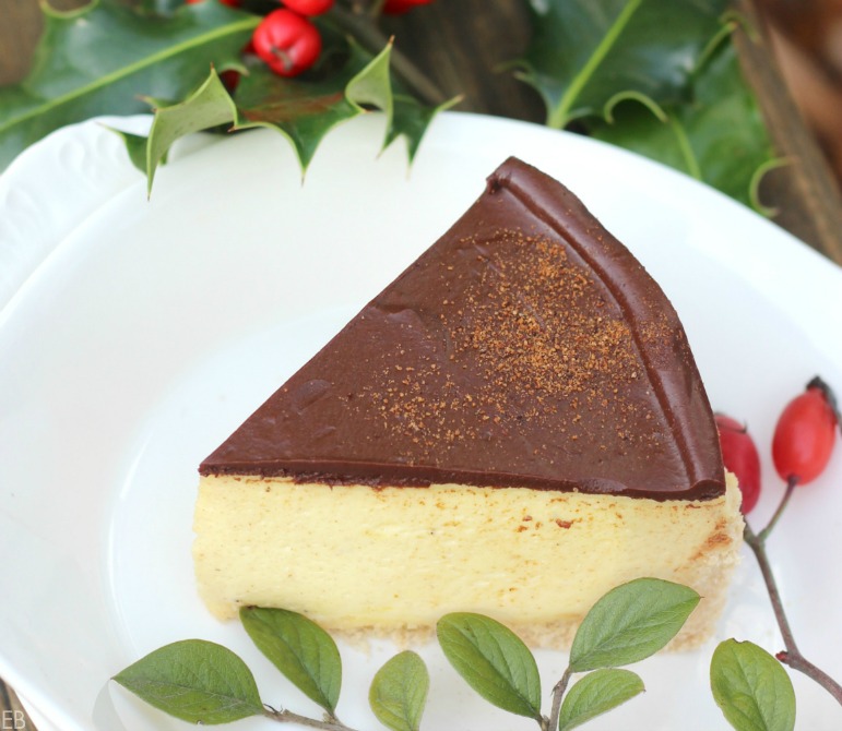 Grain free, gluten free Eggnog Cheesecake sliced on plate ready to serve