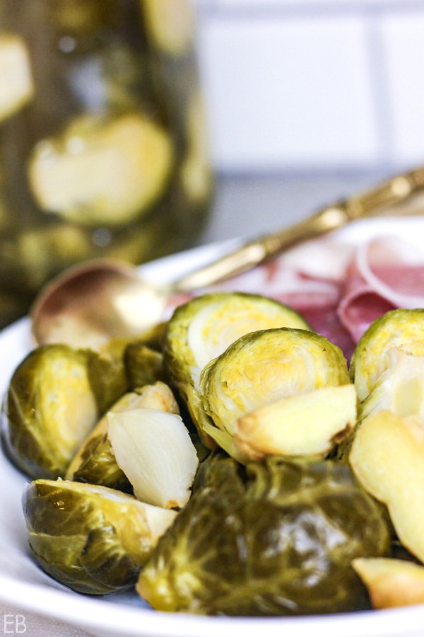 dish of fermented brussels sprouts with gold spoon