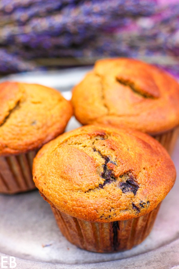 3 paleo blueberry-banana muffins on a pewter plate