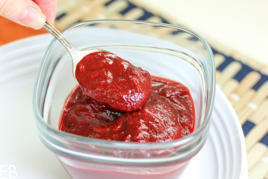 Paleo, AIP and GAPS BBQ Sauce in a bowl being scooped up with a spoon