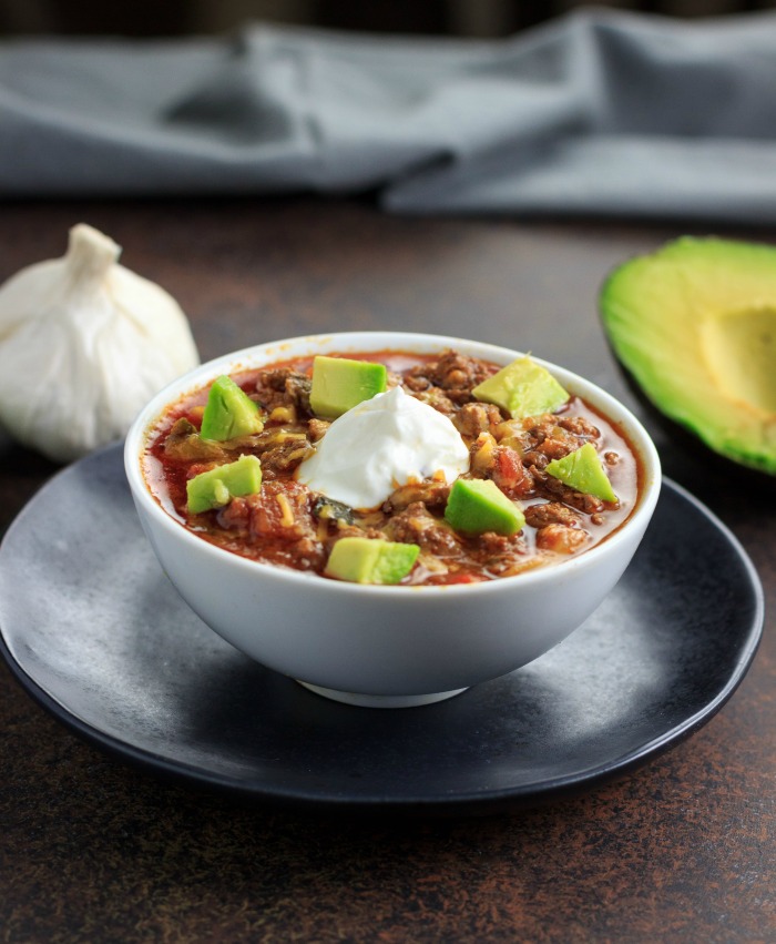 25 keto meals on a budget. this one is keto chili in a white bowl.