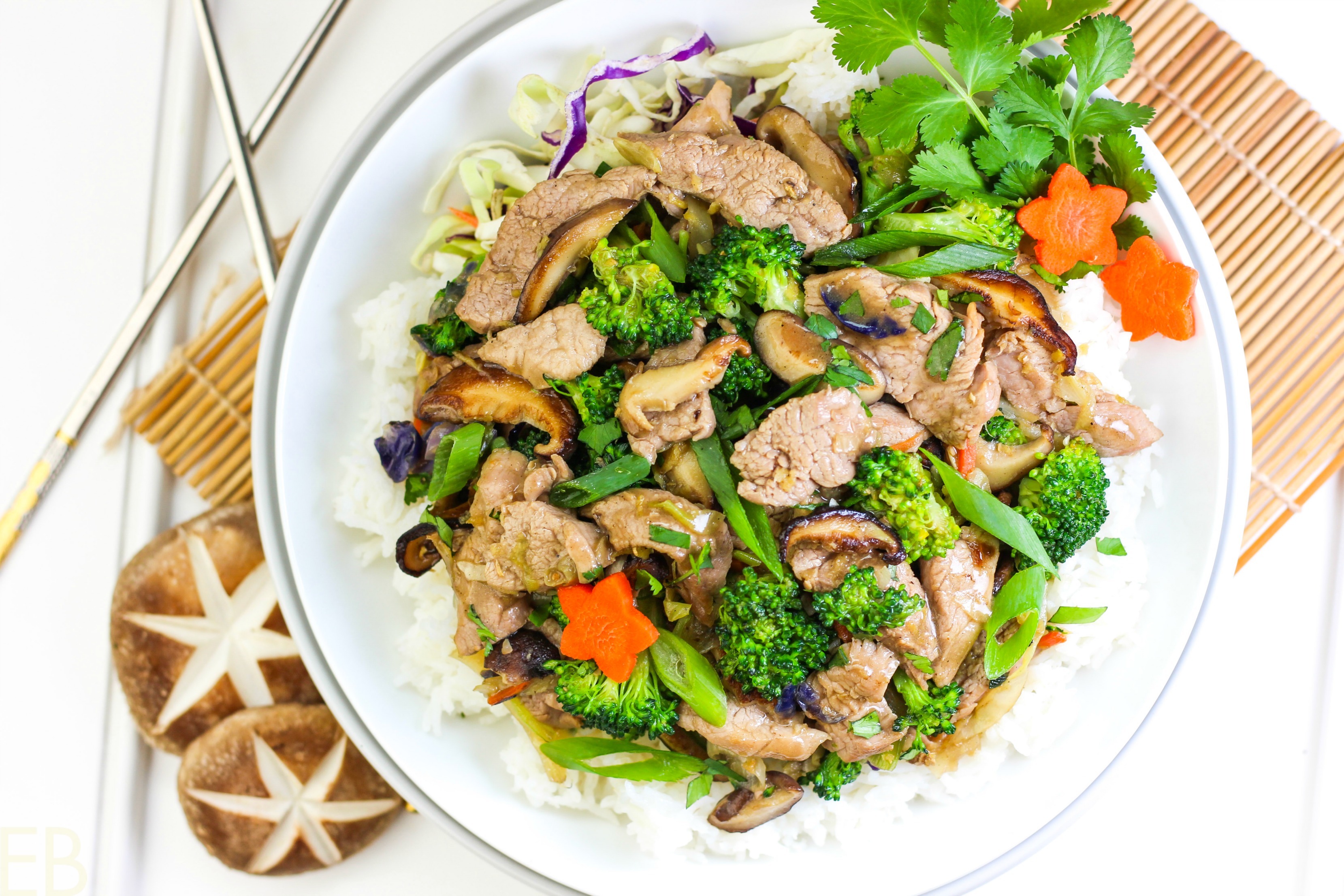 a broad bowl with whole30 aip paleo gaps chinese hot and sour stir fry inside: pork tenderloin slices, broccoli, green onions