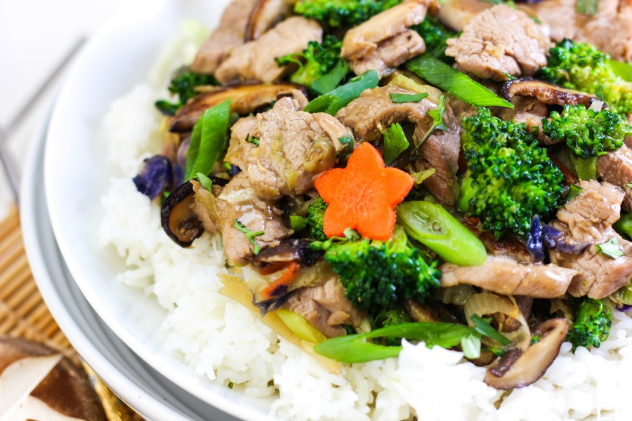 a broad bowl with whole30 aip paleo gaps chinese hot and sour stir fry inside: pork tenderloin slices, broccoli, green onions and a stamp that says 20 minutes one pan