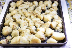 pan of potatoes about to bake