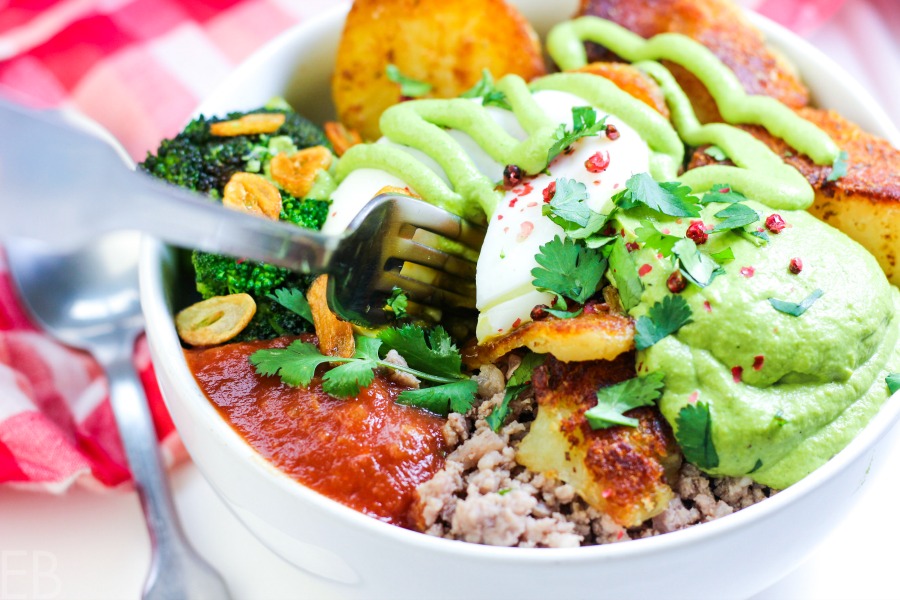 white bowl full of whole30 paleo meat broccoli garlic salsa and crispy potatoes