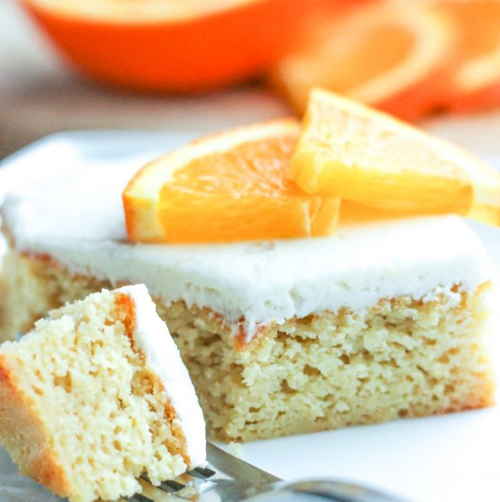 a piece of keto orange creamsicle cake with a fork
