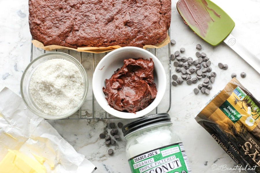 the ingredients for keto tahini brownies spread out including ganache