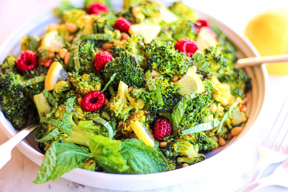 side view of roasted broccoli salad in white dish