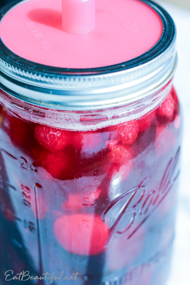 raspberry beet kvass in jar with airlock lid