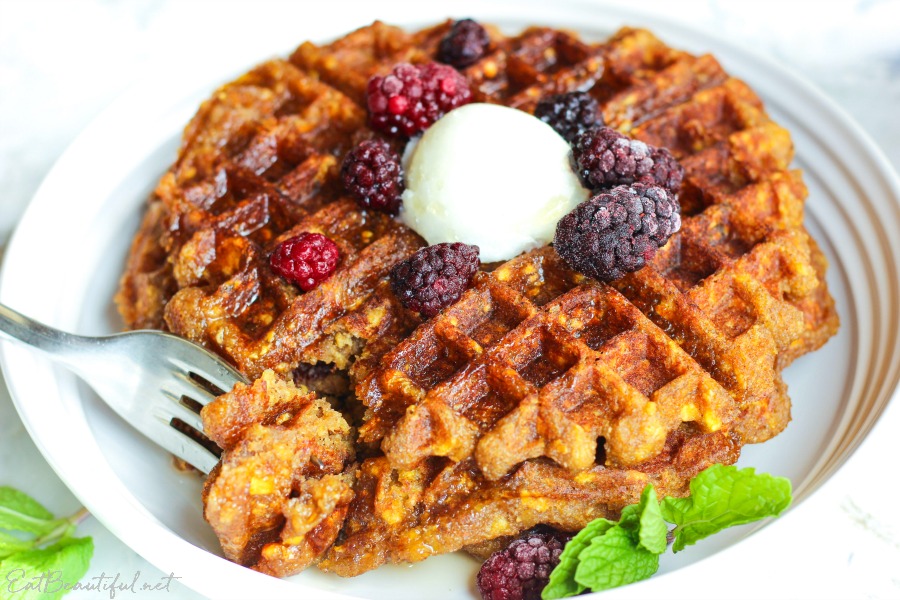 aip plantain waffles on a white plate with berries