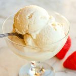 paleo vanilla ice cream in clear glass dish with spoon