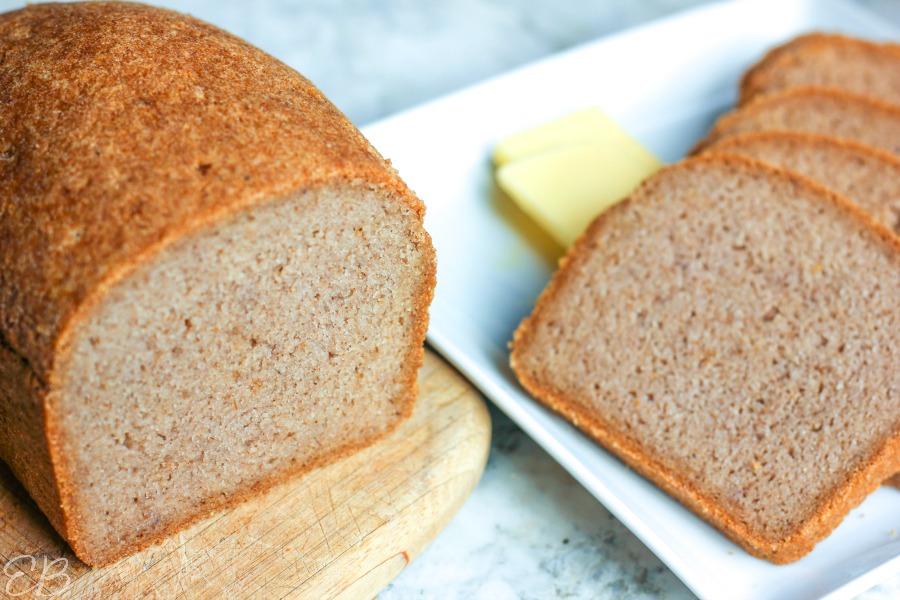 loaf of gf rice bread with slices next to it