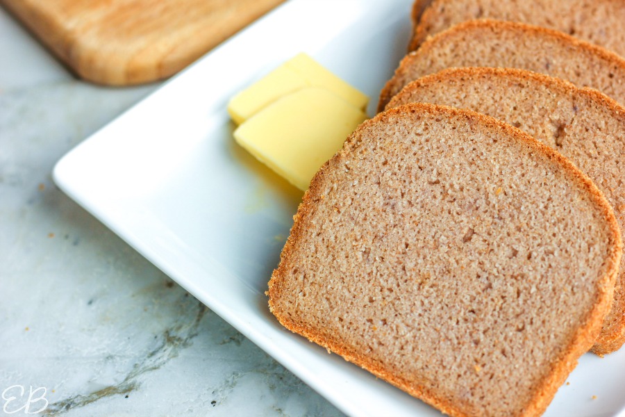 slices of gf rice bread fanned out on a plate with butter