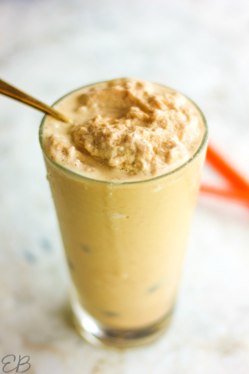 full view of low carb peanut butter shake in tall glass