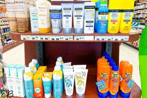 2 dozen sunscreen bottles at the grocery store