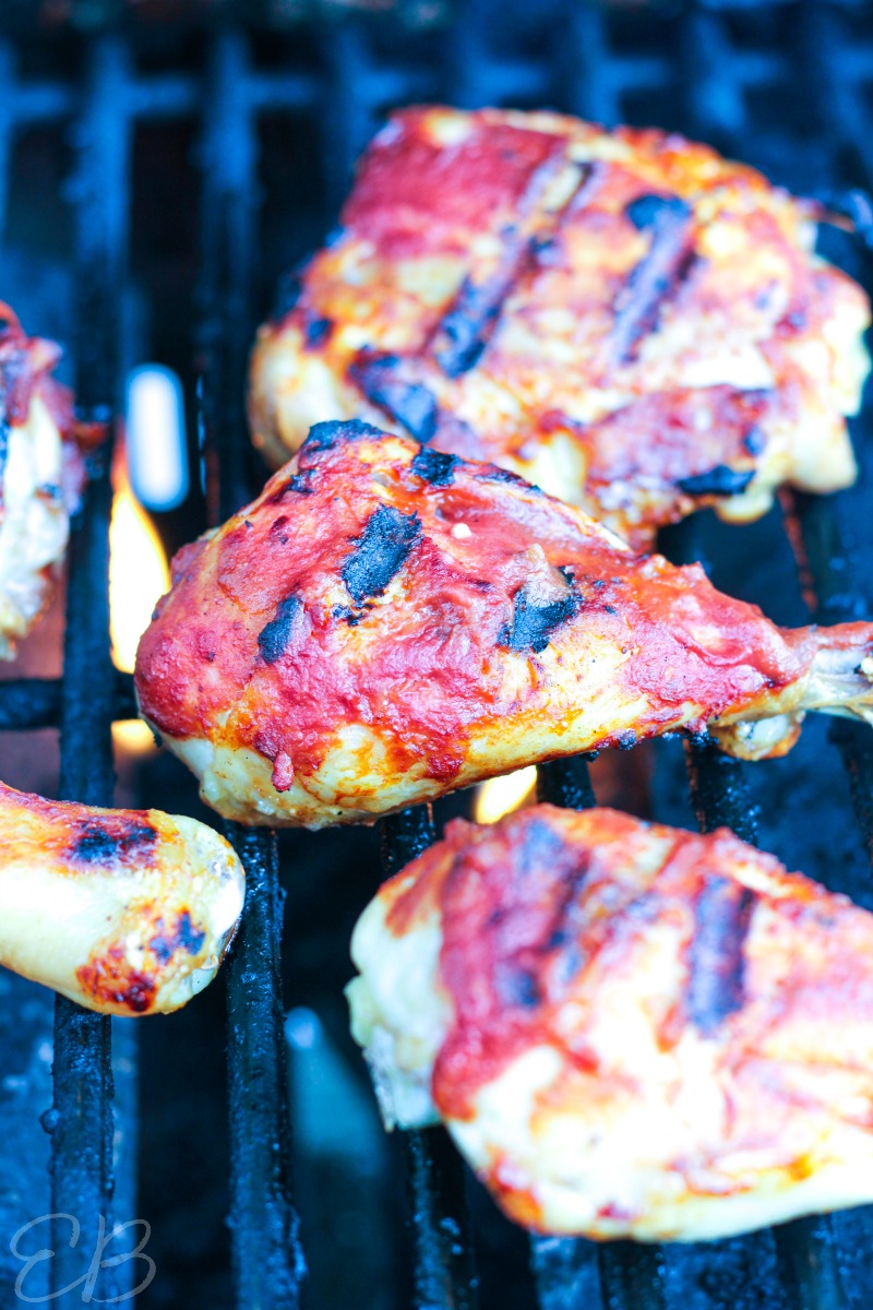 several pieces of AIP BBQ Chicken being grilled, process photo