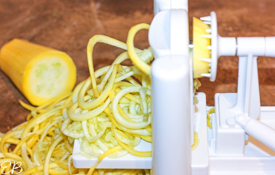 close-up view of making zucchini noodles with spiralizer