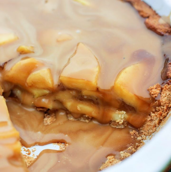 a slice cut out of aip caramel apple pie