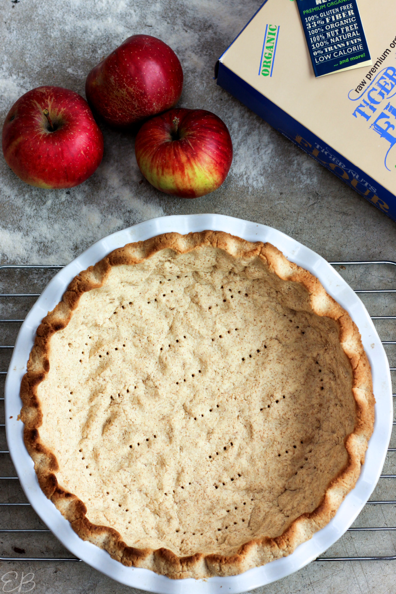 overhead view of tiger nut crust with apples on the side