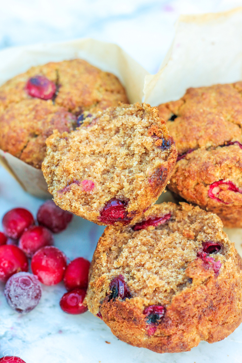 split open aip cranberry muffin with berries to one side