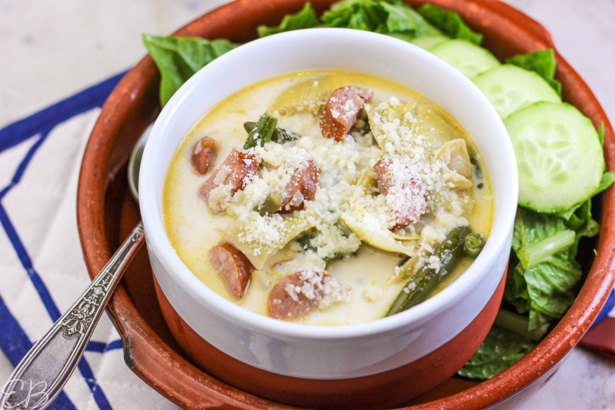 side angle view of keto italian sausage soup in white bowl