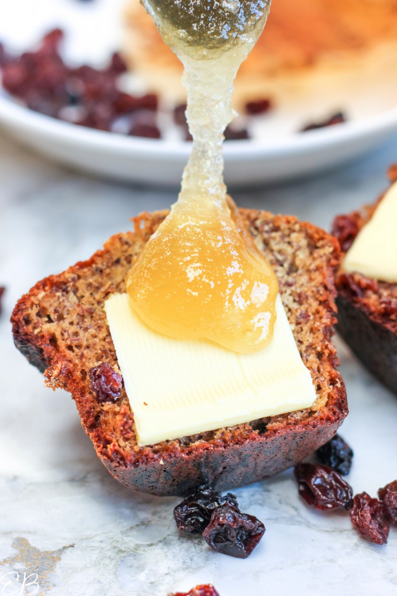 honey being drizzled on tigernut muffin