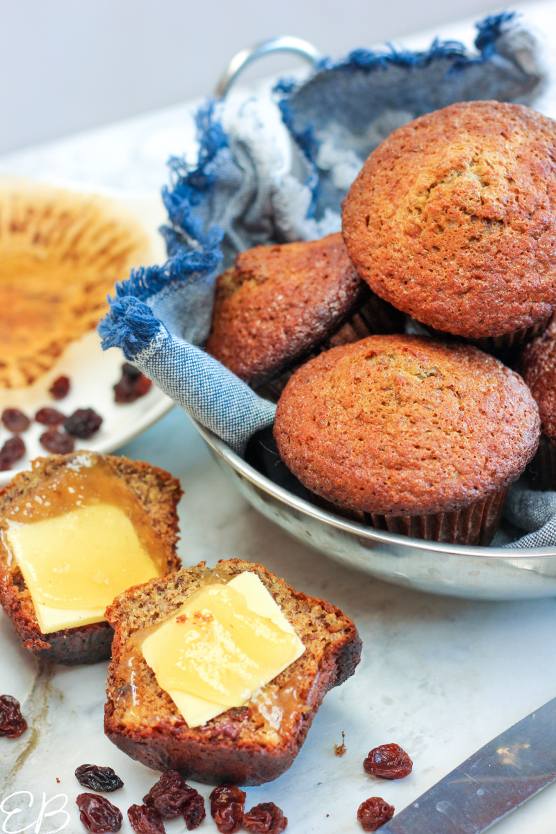 a bowl full of tigernut "bran" muffins with one to the side with butter and honey
