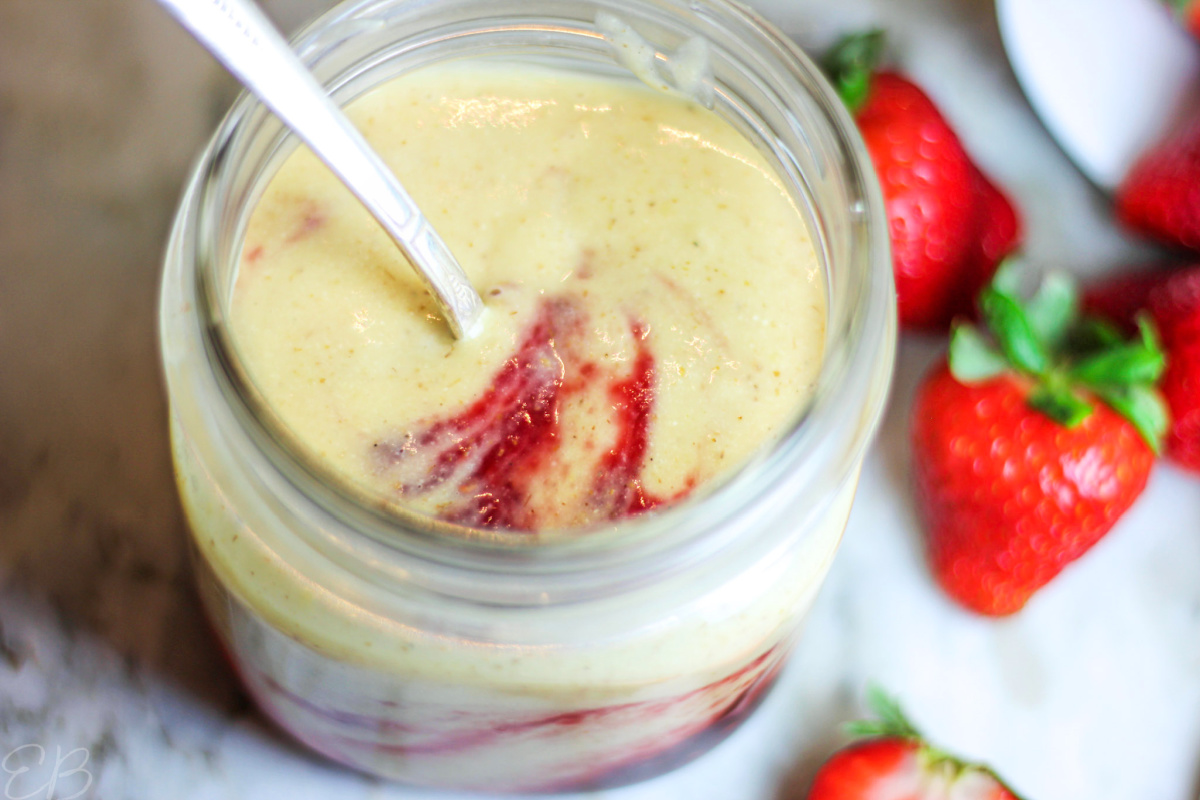 raspberry jam swirled with tiger nut yogurt in a jar