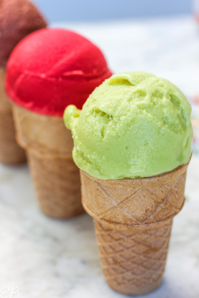 3 cones of avocado ice cream diagonally lined up