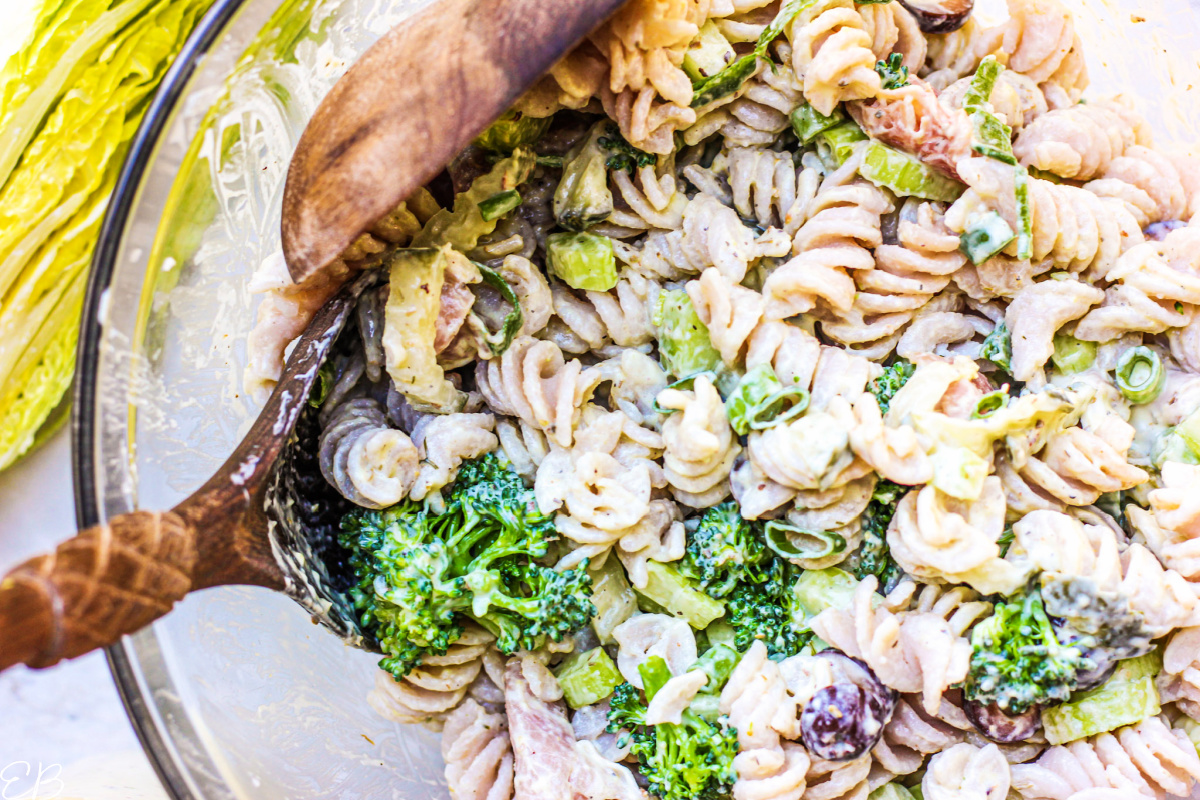 overhead view of tossed pasta salad in bowl