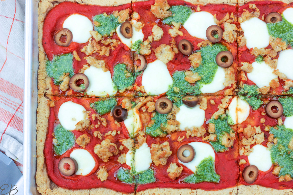 overhead view of entire AIP pizza with toppings, cut into sections