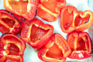 overhead view of freshly roasted red bell peppers before being stuffed