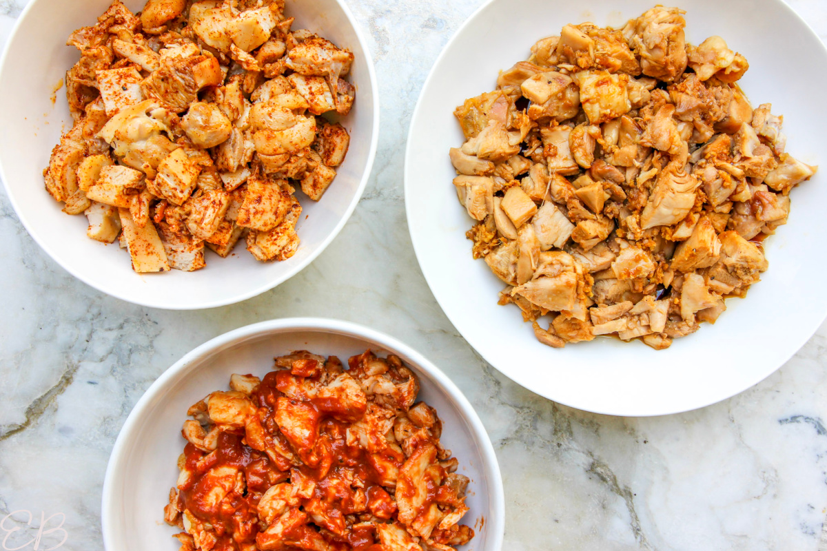 overhead view of 3 bowls with different kinds of chicken thighs