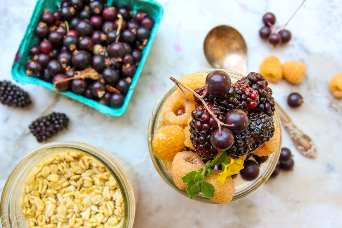 overhead view of oats jar topped with fruit