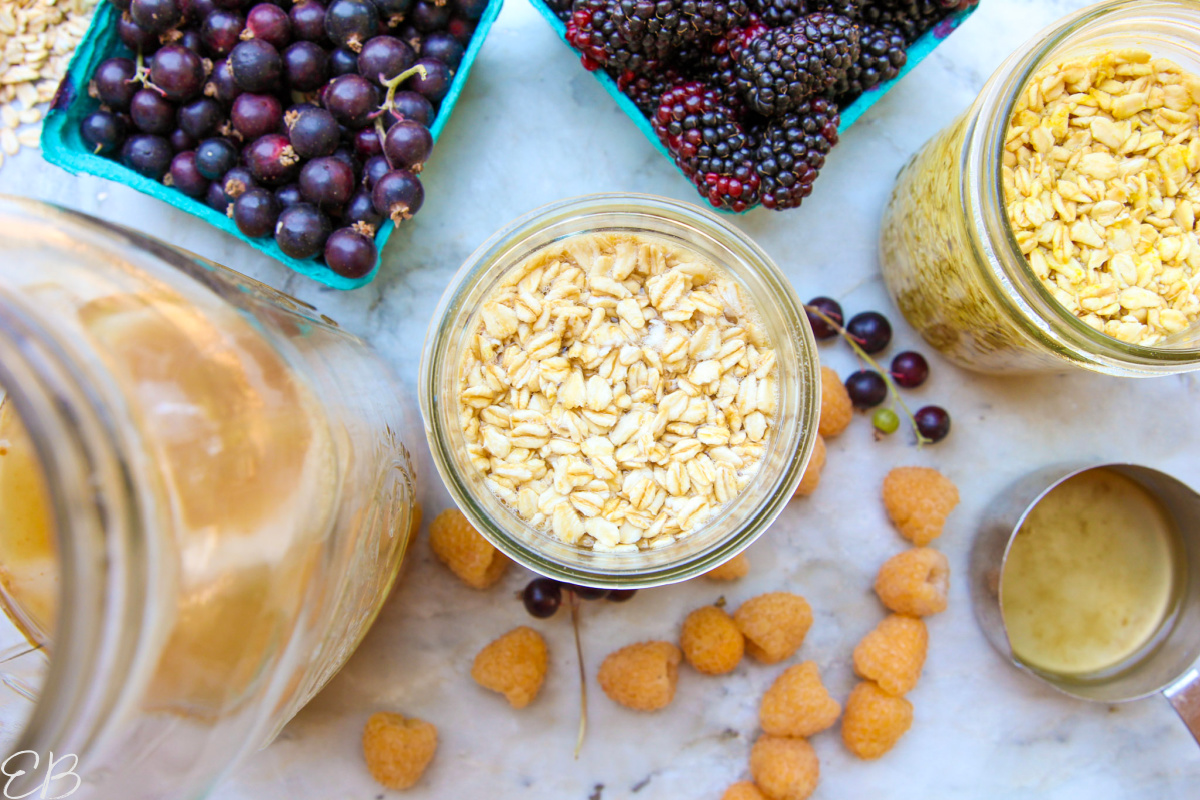 overhead view of overnight oats and its ingredients + toppings