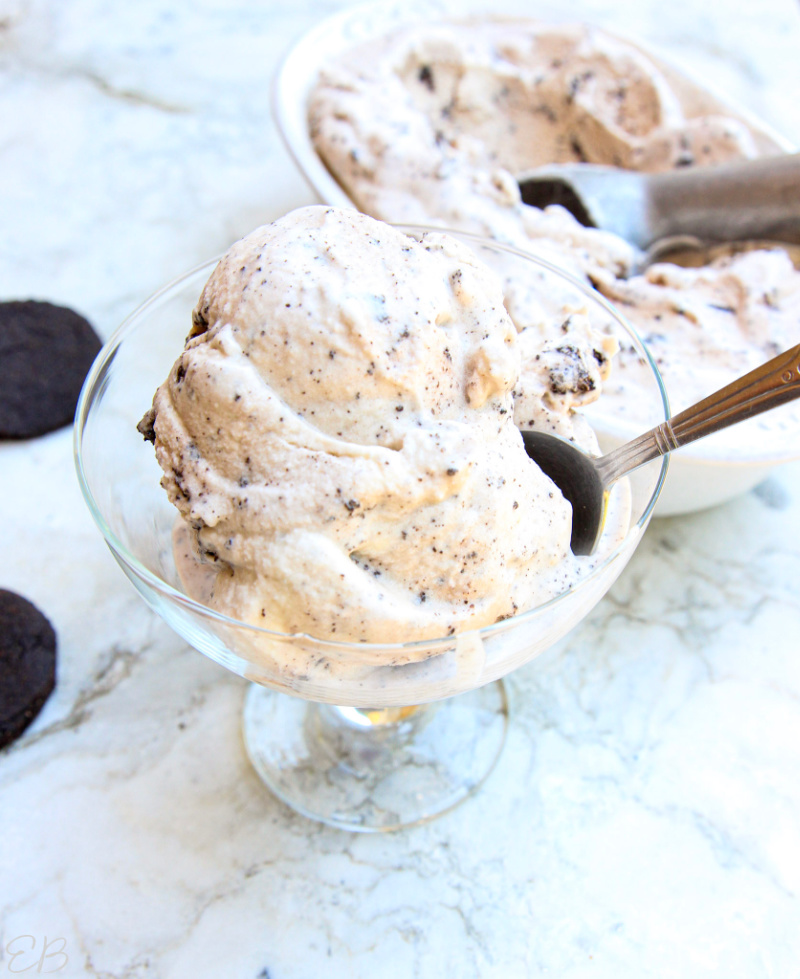 paleo cookies and cream ice cream scooped into a dish with a spoon