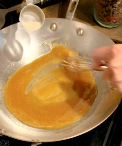 making the caramel in a saucepan for the bars