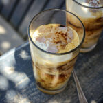 looking down into 2 glasses of tapioca floats with creamy coffee poured over