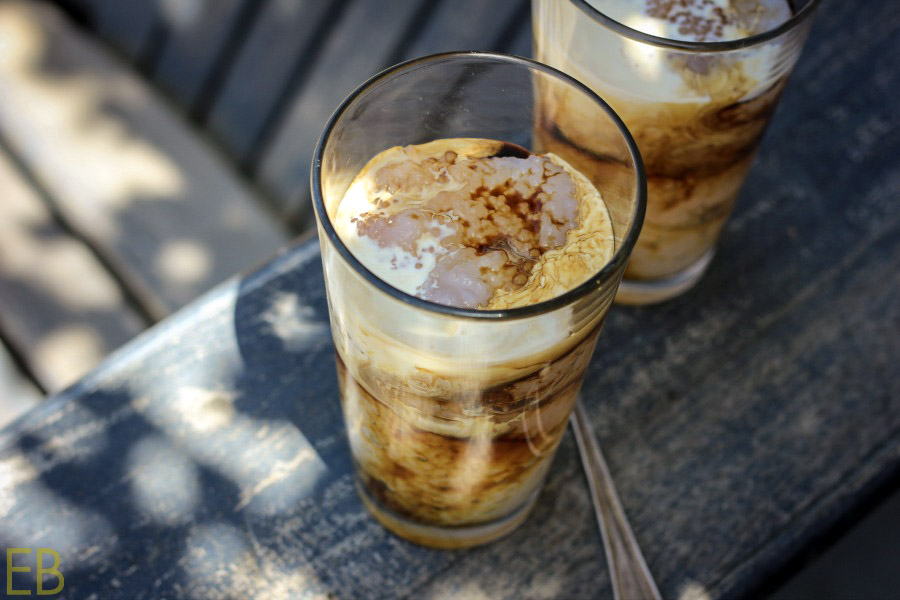 looking down into 2 glasses of tapioca floats with creamy coffee poured over