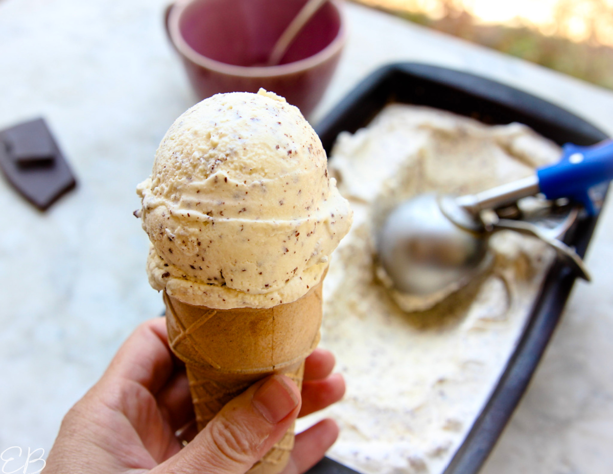 holding of cone of paleo mint chocolate chip ice cream