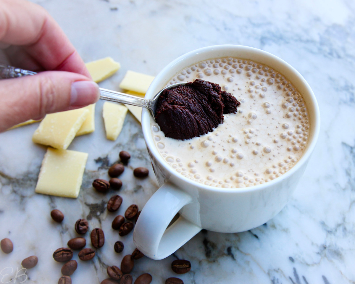 stirring a spoonful of ganache into cocoa butter bulletproof coffee