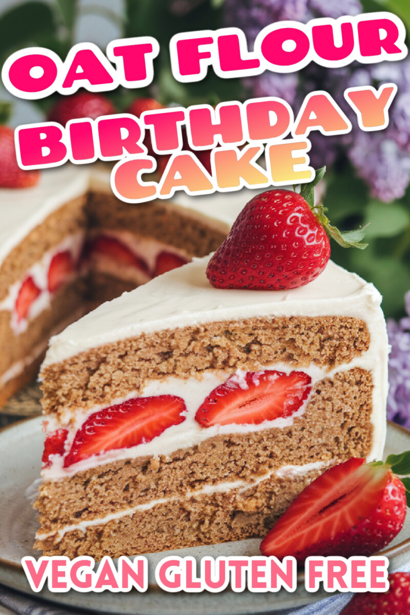oat flour cake made into a birthday cake with dairy free buttercream frosting and fresh strawberries